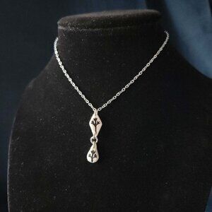 Gothic whimsigoth silver witch flower necklace with a small silver chain